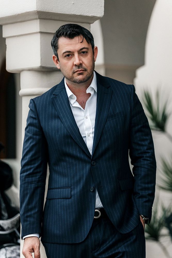 Greg Wilson in a pinstripe suit, discussing no win no fee claims.